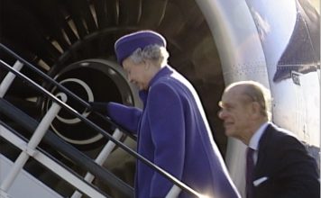 Late Queen Elizabeth with Duke in front of aircraft engine